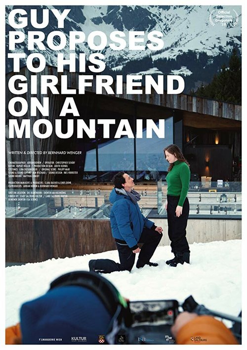 Guy proposes to his girlfriend on a mountain